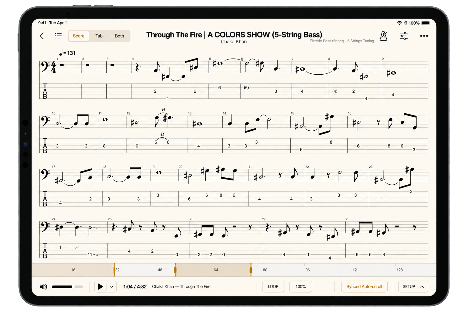 Afinar shown on an iPad in landscape. A five-string bass score for Through The Fire by Chaka Khan — notation over tab across four systems — with a Score / Tab / Both switch in the toolbar, the position bar marking bars 16 to 128 with a loop set around bar 64, and the play controls, Loop, speed, Synced Auto-scroll and Setup along the bottom.